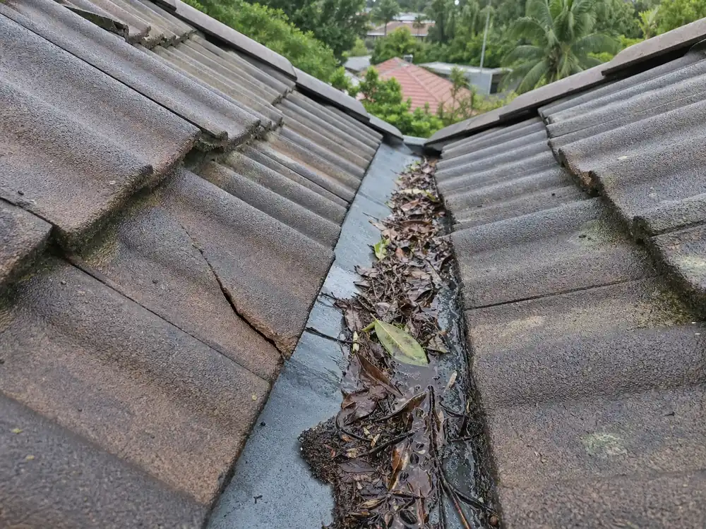 Simulated close condition scene showing debris and damaged tiles beside a valley