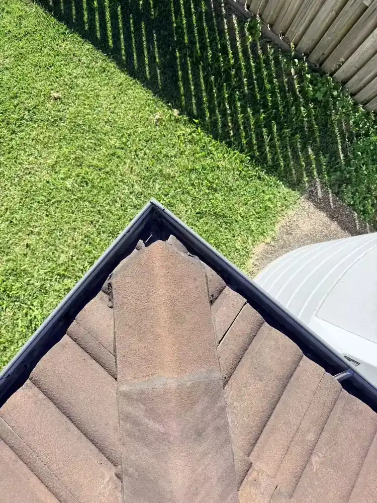 Owner-supplied close view of a tiled hip and pointing detail