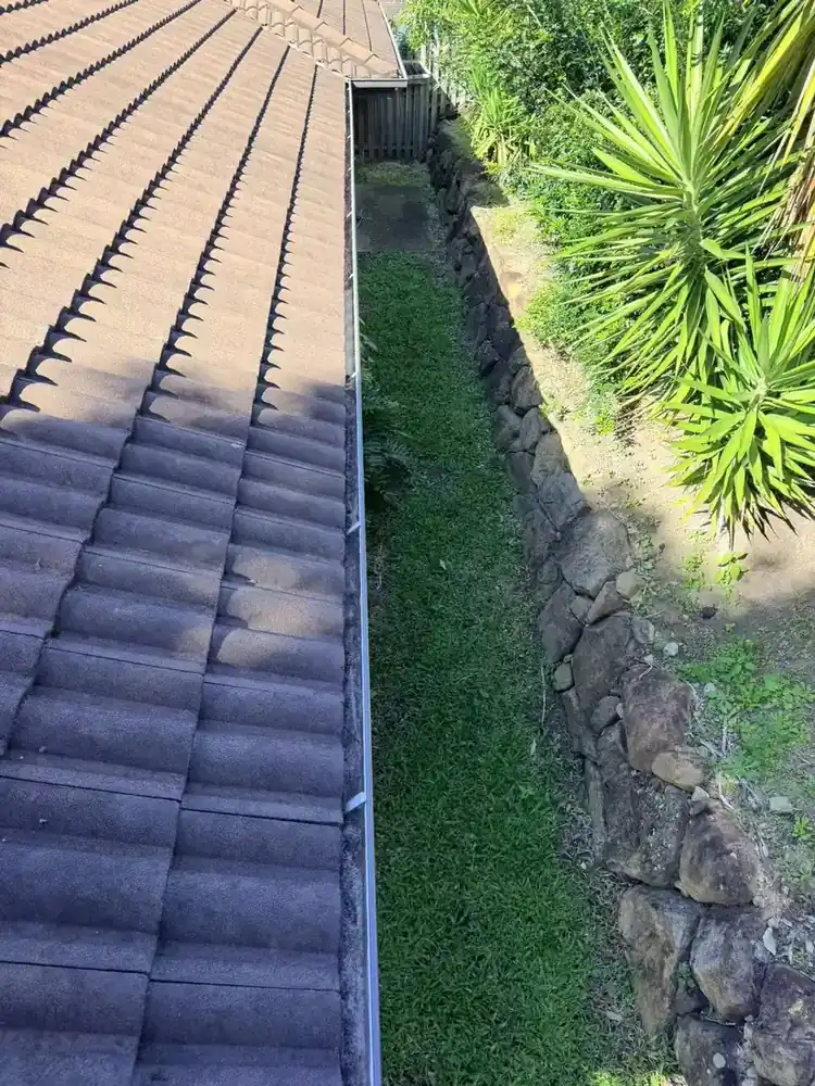 Owner-supplied overview of tiles along a roof-edge water channel