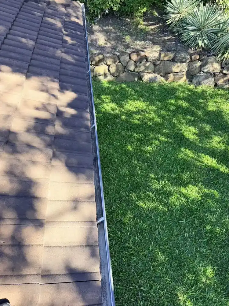 Owner-supplied overview of tiled roof edge and gutter alignment